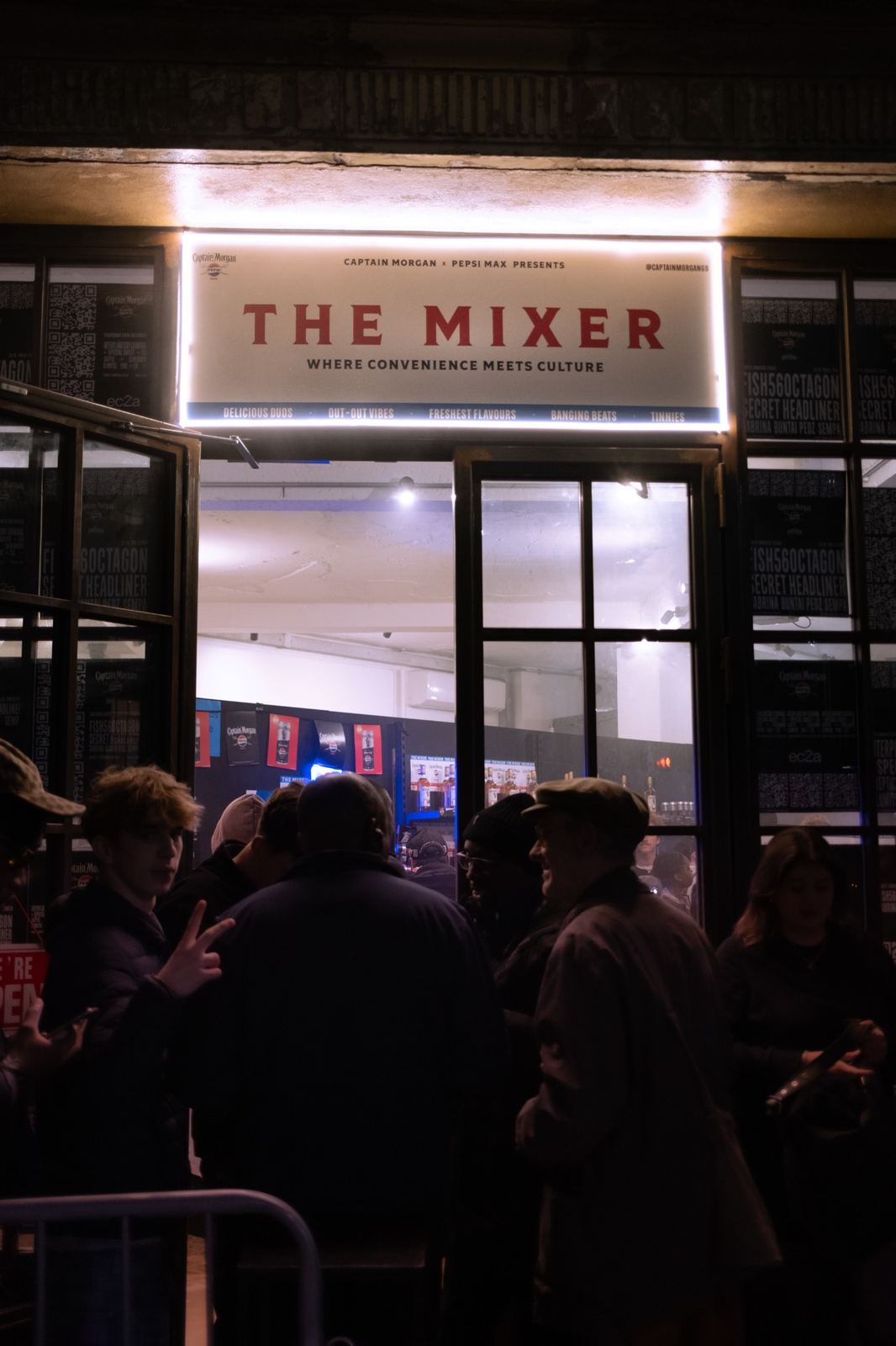Queue outside The Mixer pop-up at night.